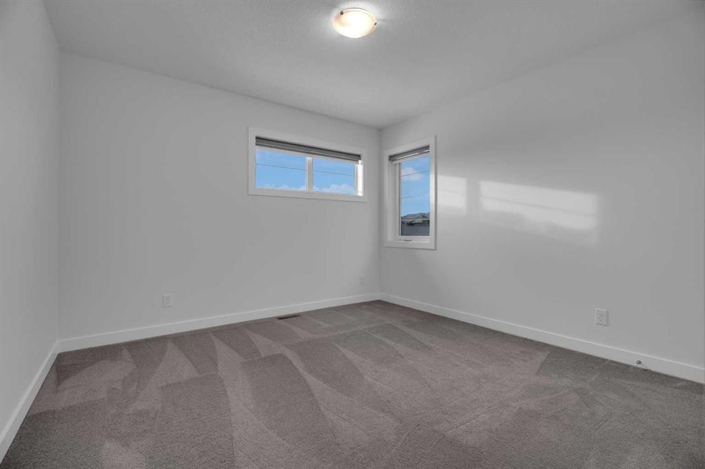 #208 Dawson Harbour Heights, Chestermere, AB - Indoor Photo Showing Other Room