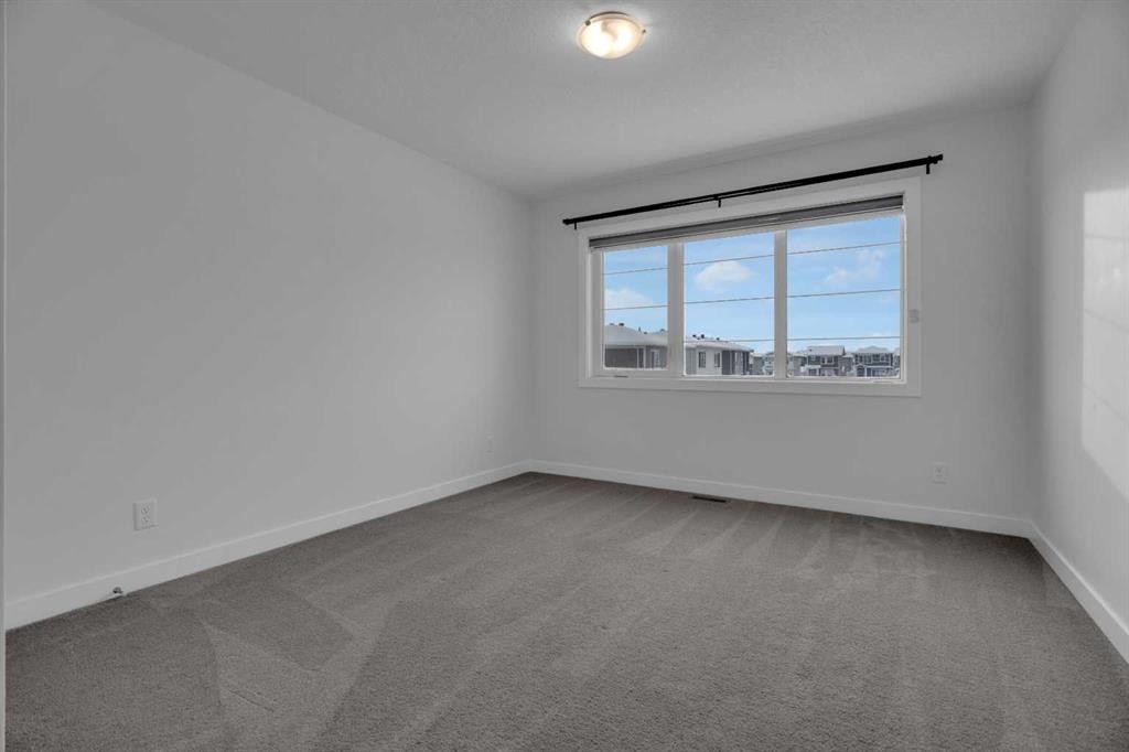 #208 Dawson Harbour Heights, Chestermere, AB - Indoor Photo Showing Other Room