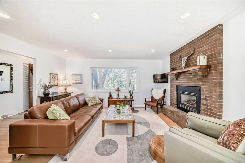 91 Chisholm Crescent Nw, Calgary, AB - Indoor Photo Showing Living Room With Fireplace
