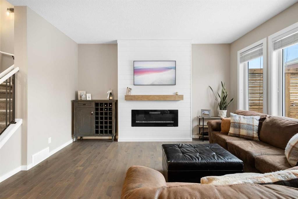 41 Marquis Common Se, Calgary, AB - Indoor Photo Showing Living Room With Fireplace