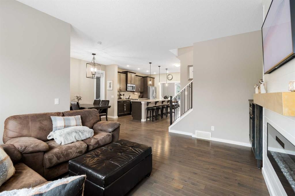 41 Marquis Common Se, Calgary, AB - Indoor Photo Showing Living Room With Fireplace