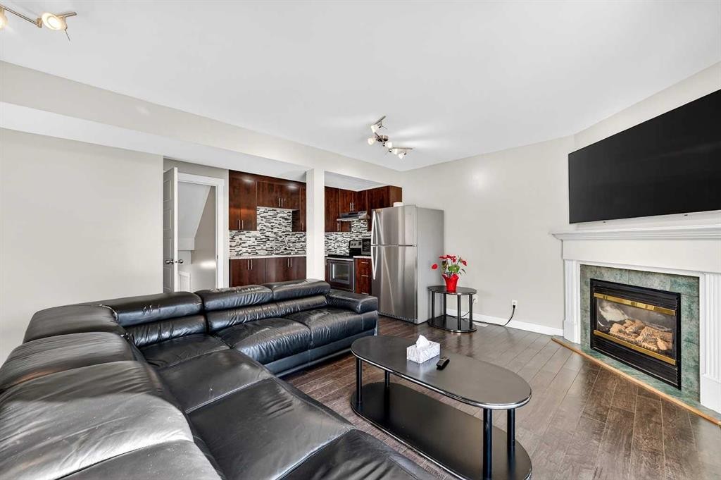312 Martin Crossing Way Ne, Calgary, AB - Indoor Photo Showing Living Room With Fireplace