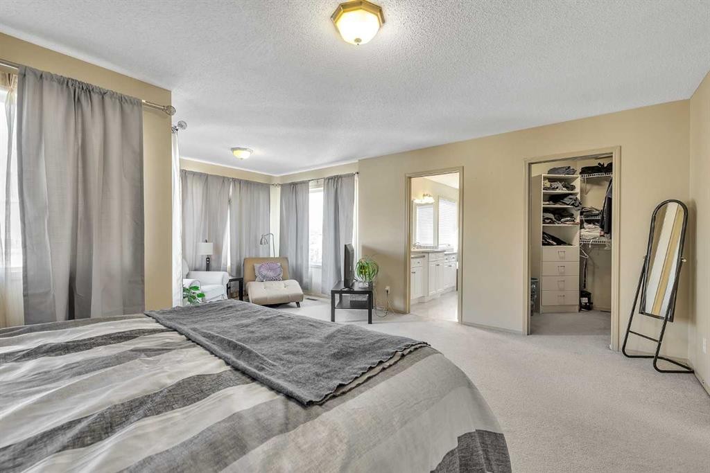 97 Everwillow Close Sw, Calgary, AB - Indoor Photo Showing Bedroom