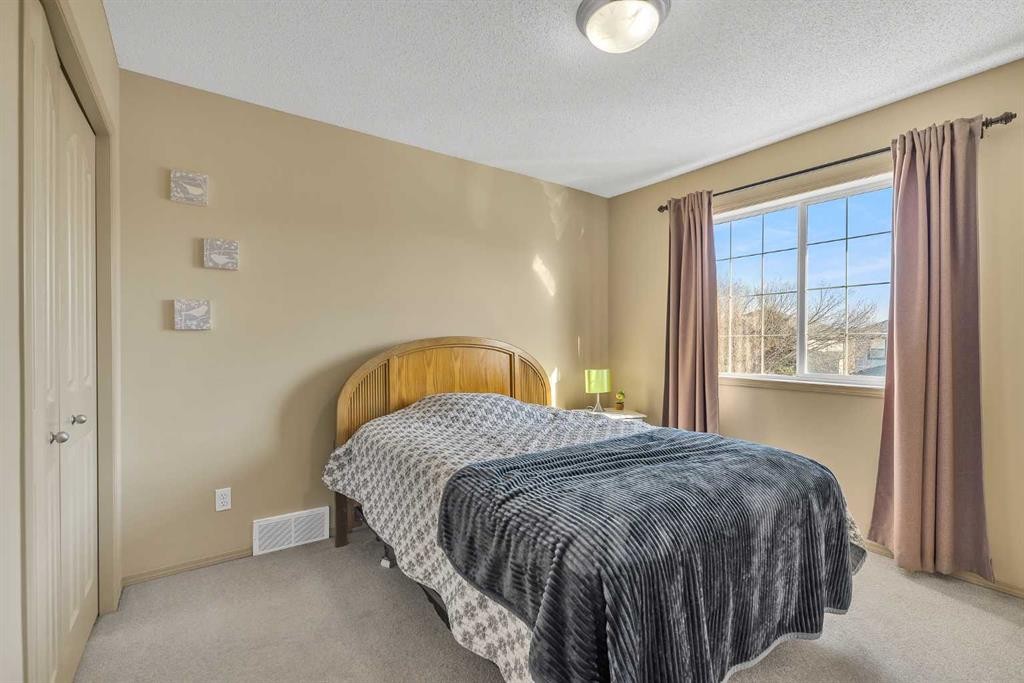 97 Everwillow Close Sw, Calgary, AB - Indoor Photo Showing Bedroom