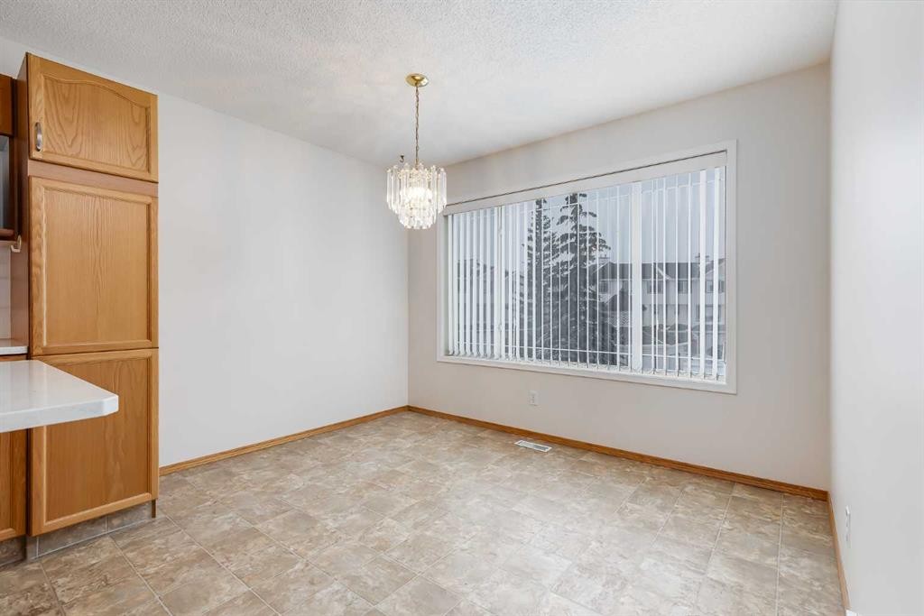 153 Rocky Ridge Court Nw, Calgary, AB - Indoor Photo Showing Other Room