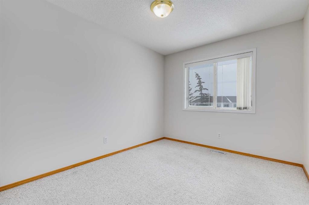 153 Rocky Ridge Court Nw, Calgary, AB - Indoor Photo Showing Other Room