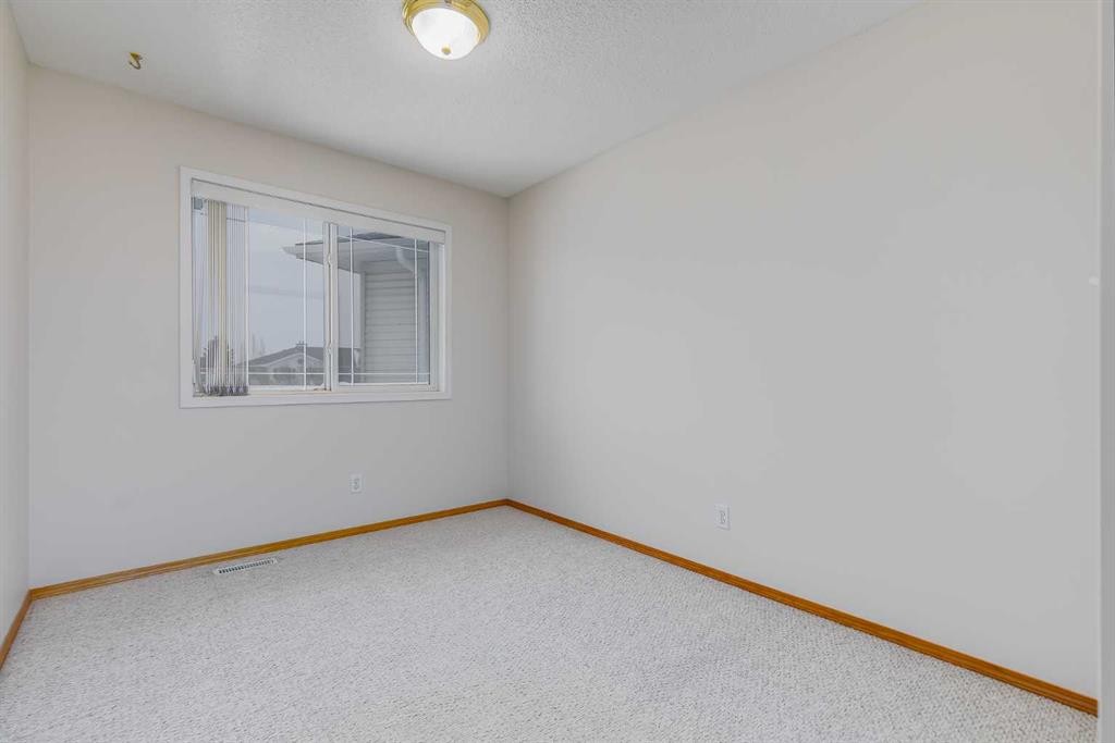153 Rocky Ridge Court Nw, Calgary, AB - Indoor Photo Showing Other Room