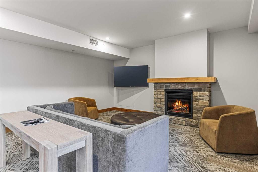 402-1315 Spring Creek Gate, Canmore, AB - Indoor With Fireplace