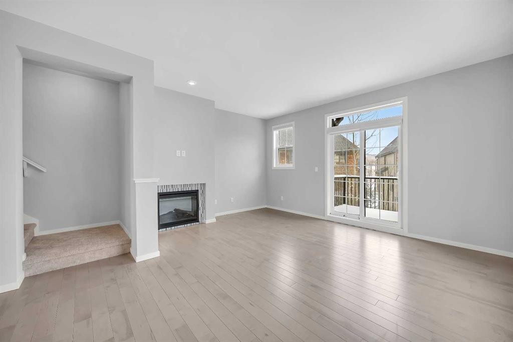 455 Ascot Circle Sw, Calgary, AB - Indoor Photo Showing Living Room With Fireplace