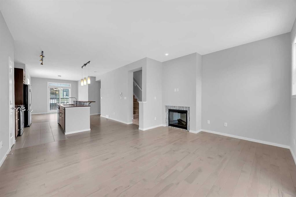 455 Ascot Circle Sw, Calgary, AB - Indoor Photo Showing Living Room With Fireplace
