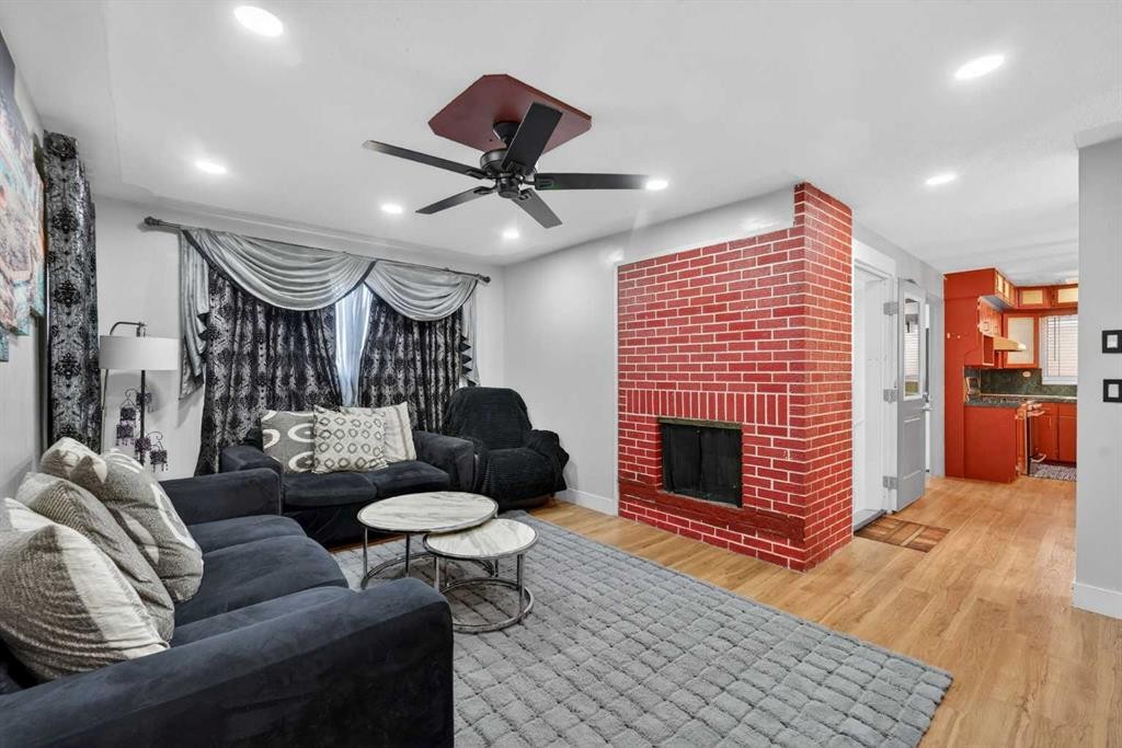6003 Pinepoint Drive Ne, Calgary, AB - Indoor Photo Showing Living Room With Fireplace