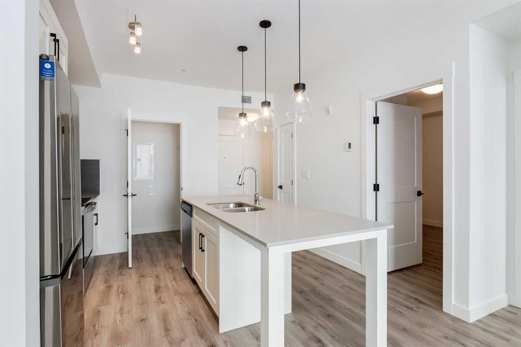 4111-200 Seton Circle Se, Calgary, AB - Indoor Photo Showing Kitchen With Double Sink