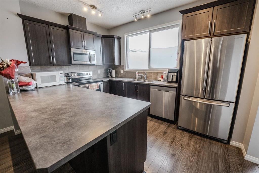 281 Cornerstone Passage Ne, Calgary, AB - Indoor Photo Showing Kitchen With Stainless Steel Kitchen With Double Sink