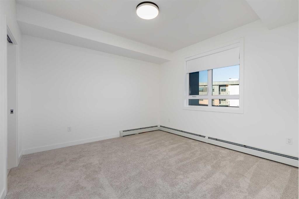 1308-520 Reynolds Avenue Sw, Airdrie, AB - Indoor Photo Showing Other Room