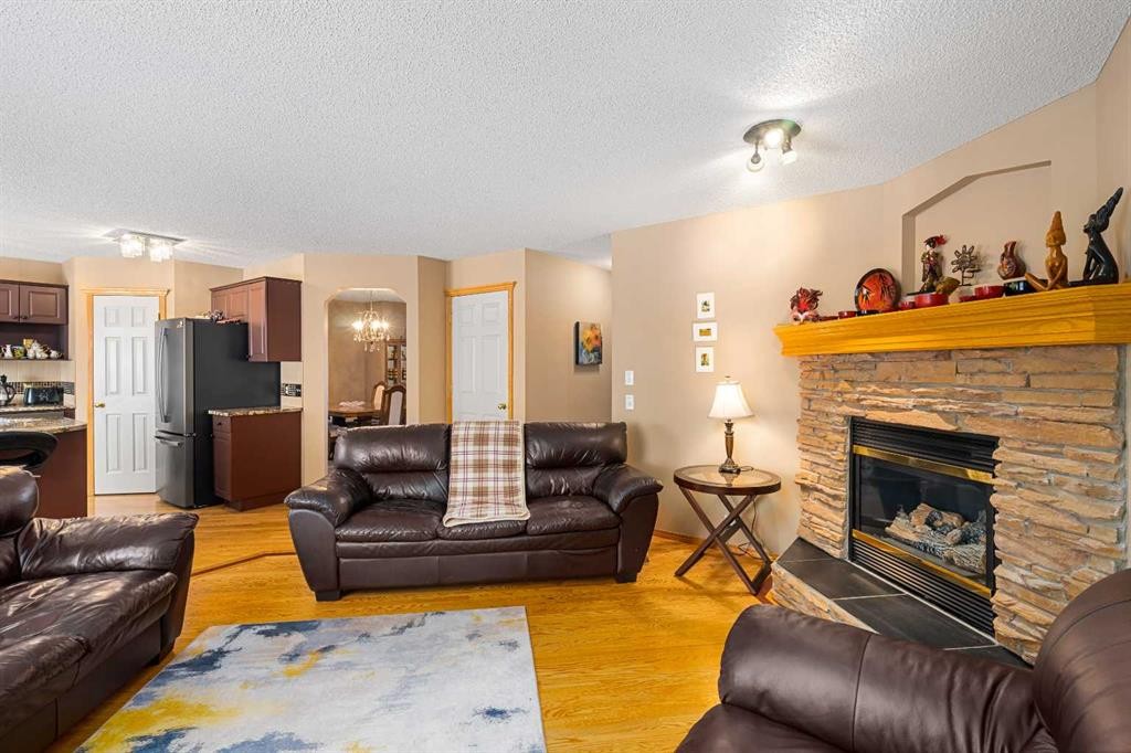 7945 Springbank Boulevard Sw, Calgary, AB - Indoor Photo Showing Living Room With Fireplace