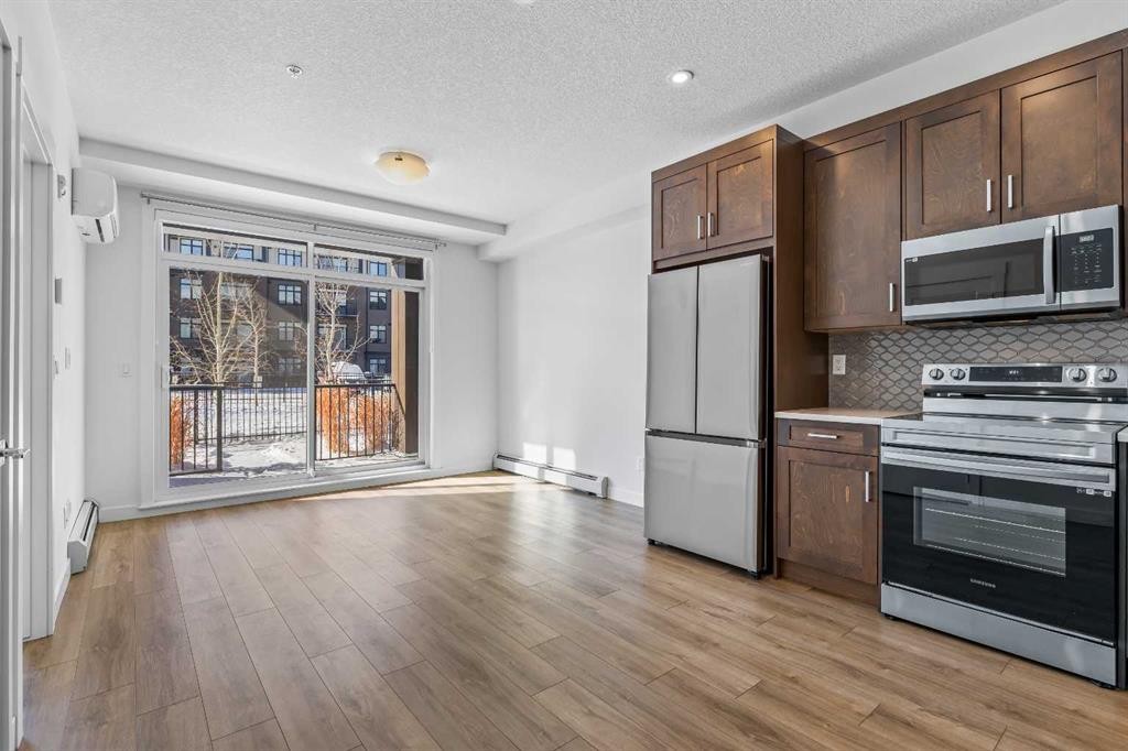 2113-200 Seton Circle Se, Calgary, AB - Indoor Photo Showing Kitchen With Stainless Steel Kitchen