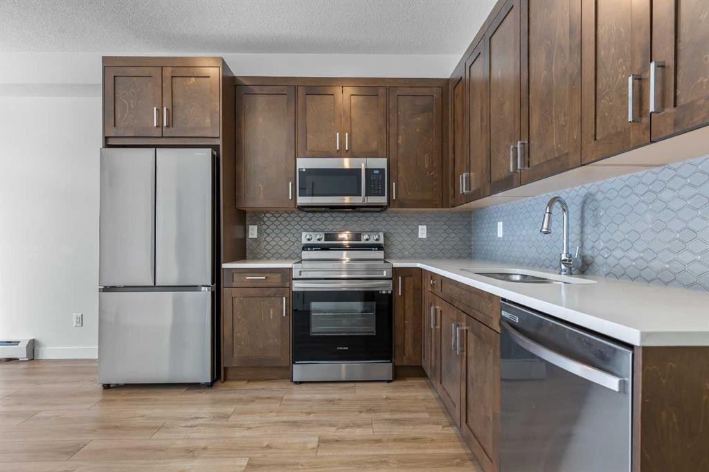 2113-200 Seton Circle Se, Calgary, AB - Indoor Photo Showing Kitchen With Stainless Steel Kitchen