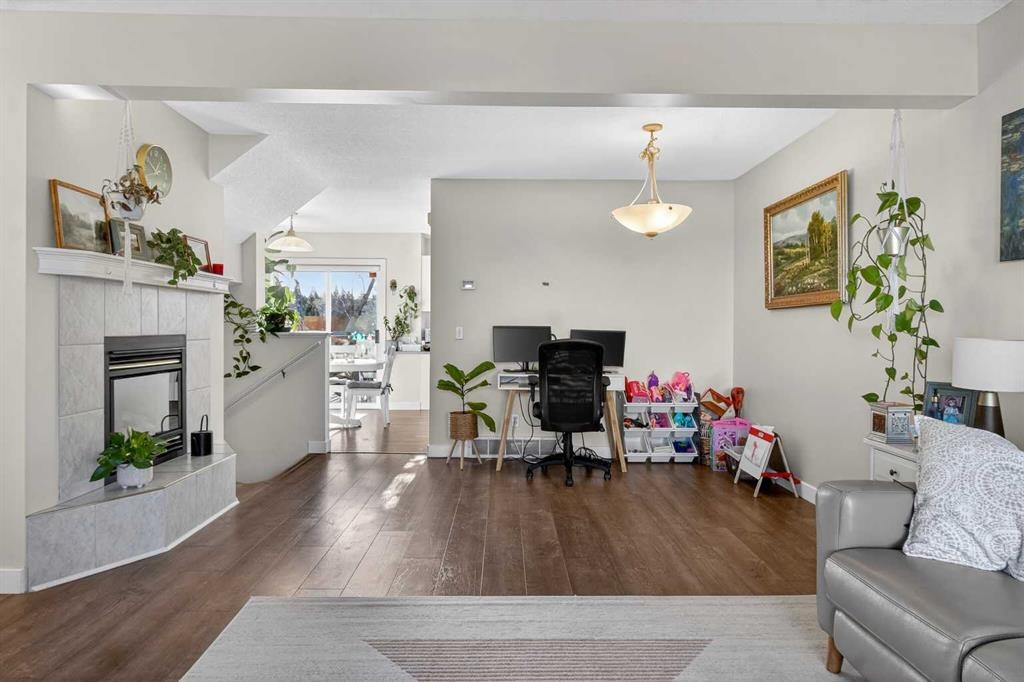 41 Sandarac Villas Nw, Calgary, AB - Indoor Photo Showing Living Room With Fireplace