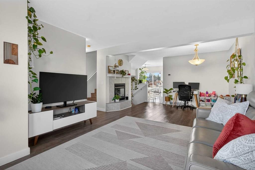 41 Sandarac Villas Nw, Calgary, AB - Indoor Photo Showing Living Room With Fireplace