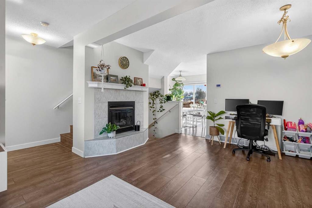 41 Sandarac Villas Nw, Calgary, AB - Indoor With Fireplace