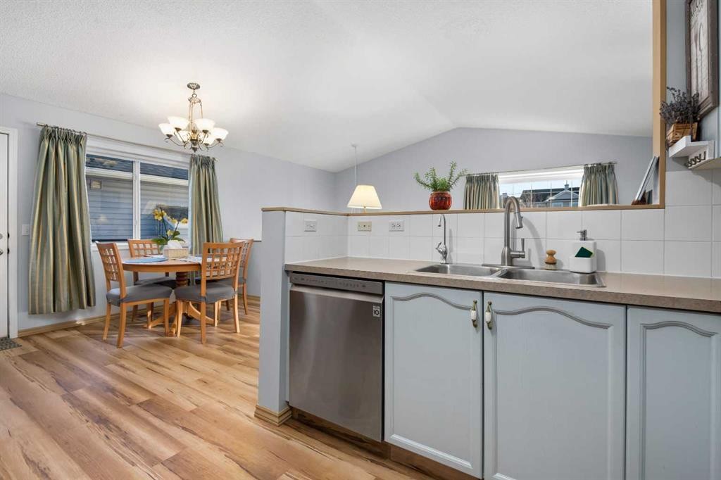 118 Bridleridge Way Sw, Calgary, AB - Indoor Photo Showing Kitchen With Double Sink