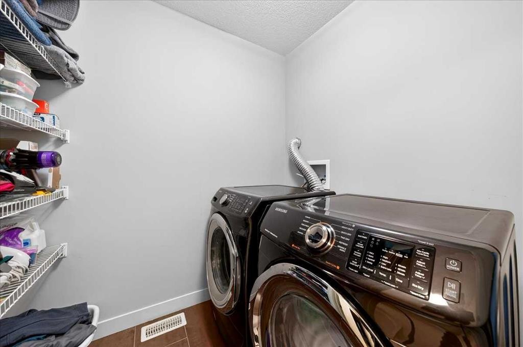 37 Aspen Hills Terrace Sw, Calgary, AB - Indoor Photo Showing Laundry Room