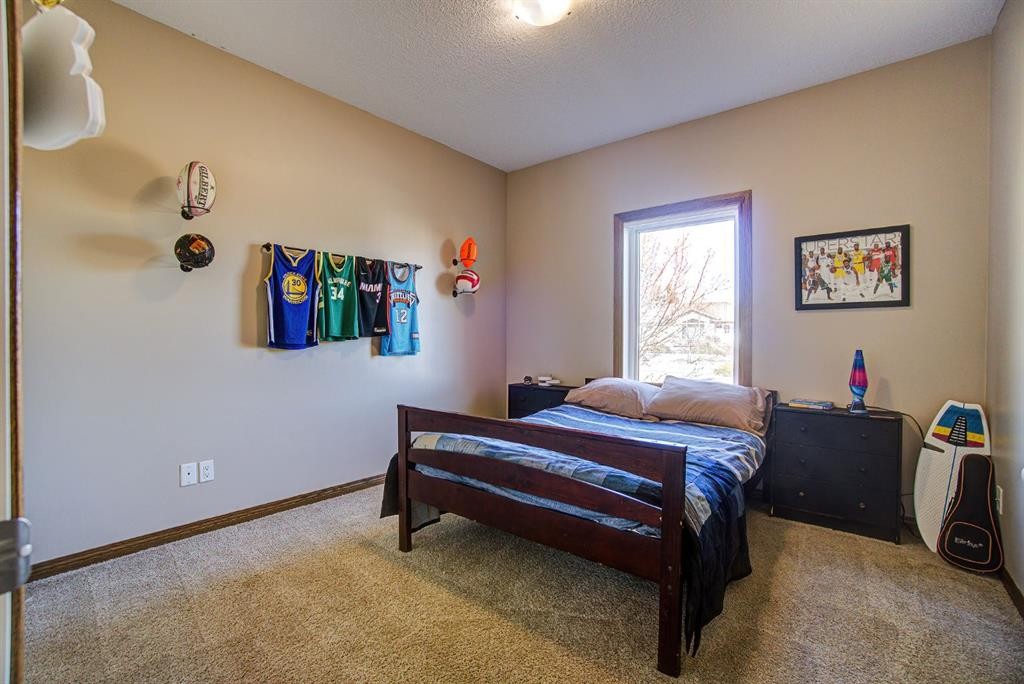 109 Derochie Drive, Claresholm, AB - Indoor Photo Showing Bedroom