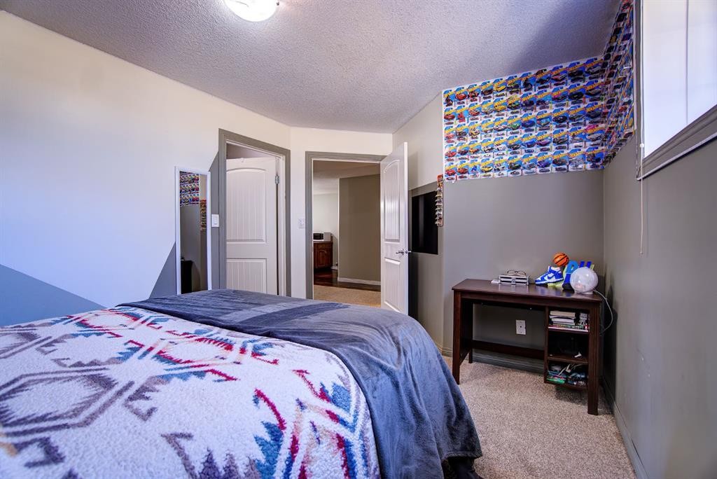109 Derochie Drive, Claresholm, AB - Indoor Photo Showing Bedroom