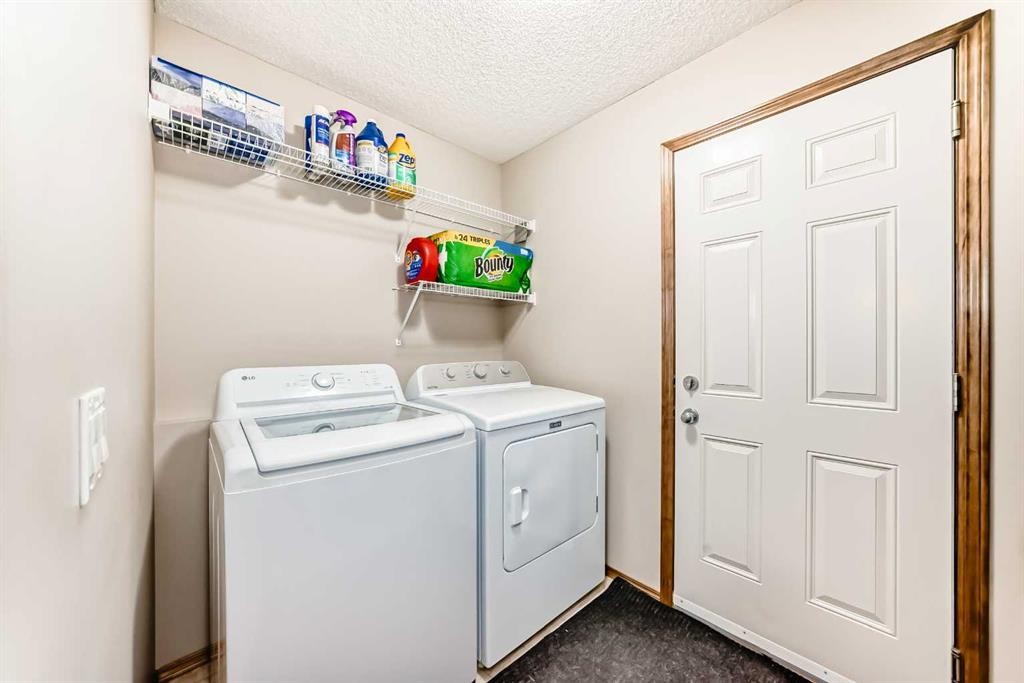 834 Cranston Drive Se, Calgary, AB - Indoor Photo Showing Laundry Room