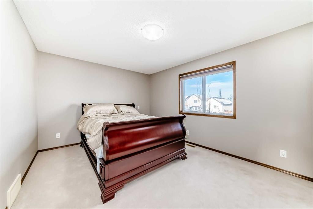834 Cranston Drive Se, Calgary, AB - Indoor Photo Showing Bedroom