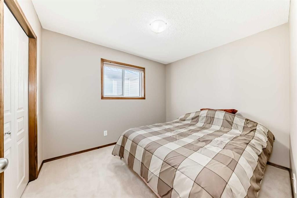 834 Cranston Drive Se, Calgary, AB - Indoor Photo Showing Bedroom