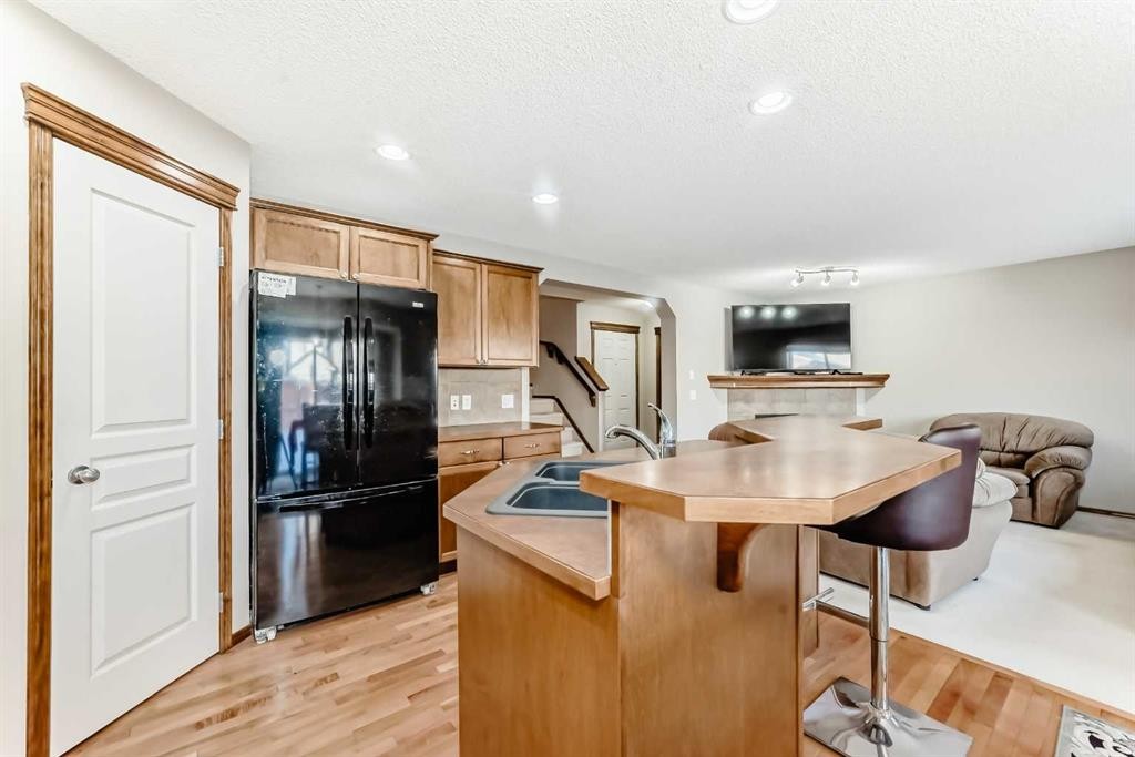 834 Cranston Drive Se, Calgary, AB - Indoor Photo Showing Kitchen With Double Sink