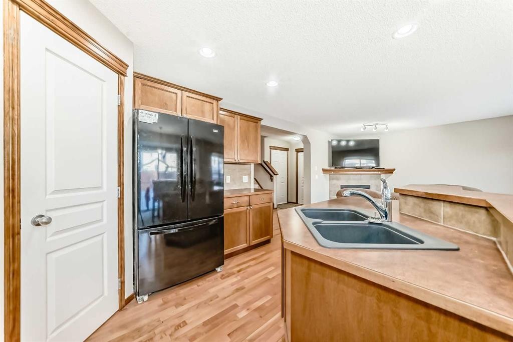 834 Cranston Drive Se, Calgary, AB - Indoor Photo Showing Kitchen With Double Sink
