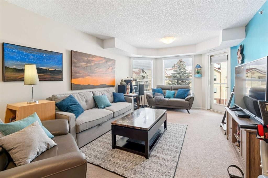 2327-1818 Simcoe Boulevard Sw, Calgary, AB - Indoor Photo Showing Living Room
