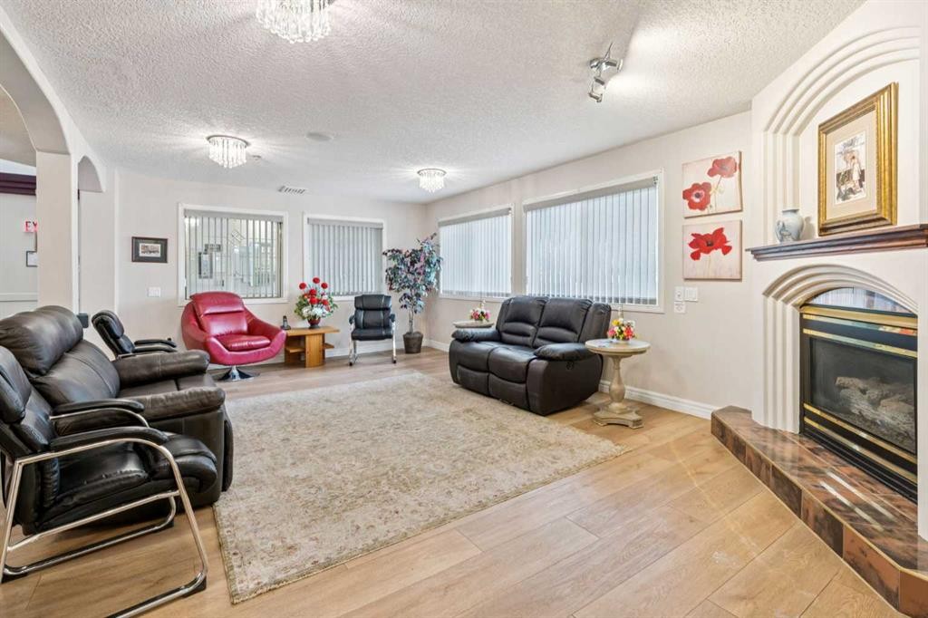 2327-1818 Simcoe Boulevard Sw, Calgary, AB - Indoor Photo Showing Living Room With Fireplace