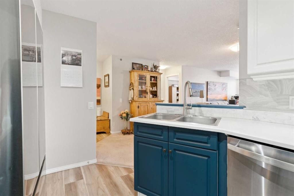 2327-1818 Simcoe Boulevard Sw, Calgary, AB - Indoor Photo Showing Kitchen With Double Sink