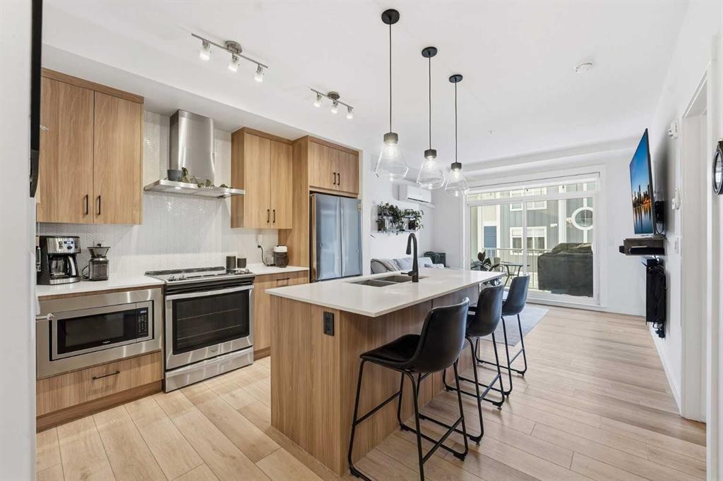 308-400 Auburn Meadows Common Se, Calgary, AB - Indoor Photo Showing Kitchen With Stainless Steel Kitchen With Upgraded Kitchen