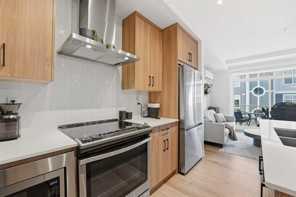308-400 Auburn Meadows Common Se, Calgary, AB - Indoor Photo Showing Kitchen With Stainless Steel Kitchen With Double Sink