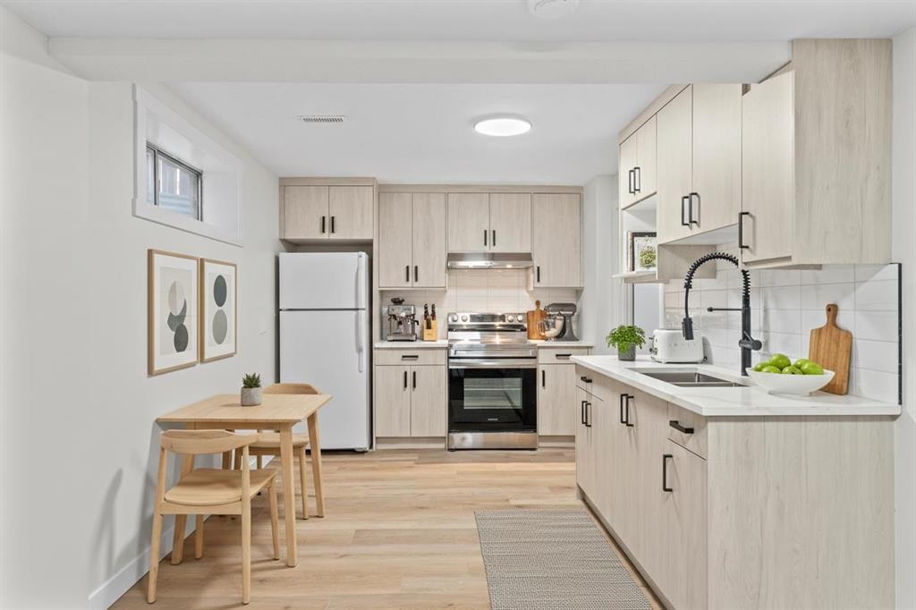 52 Martin Crossing Rise Ne, Calgary, AB - Indoor Photo Showing Kitchen With Double Sink