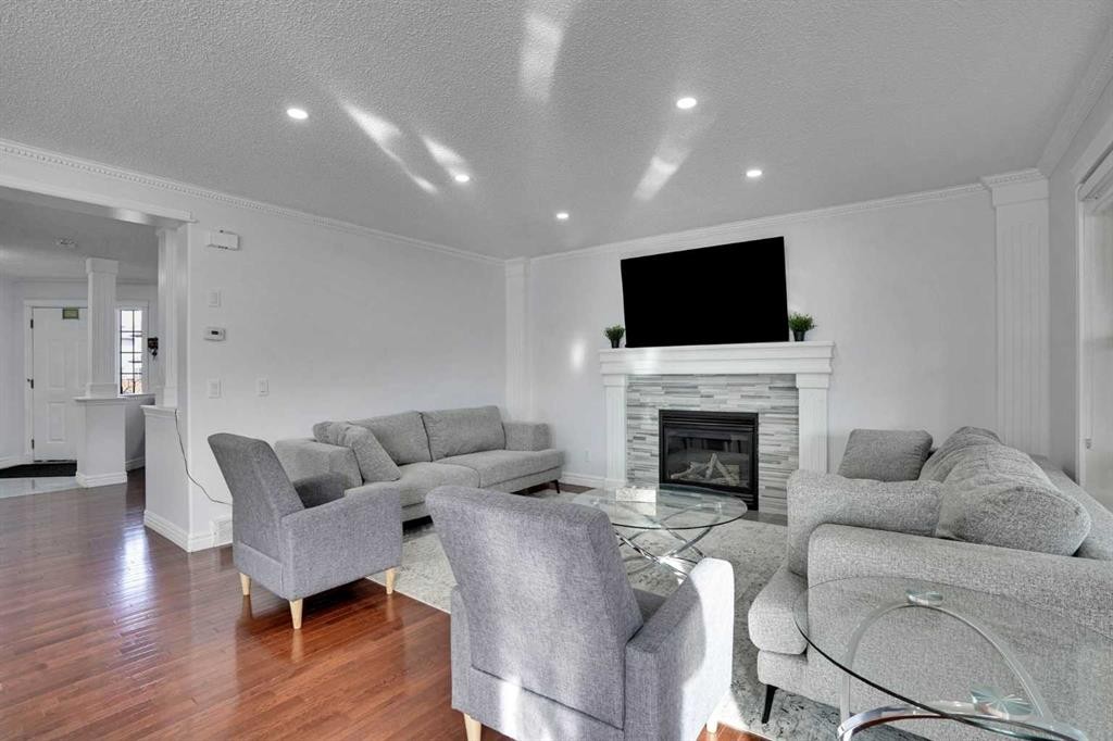 148 Martha'S Manor Ne, Calgary, AB - Indoor Photo Showing Living Room With Fireplace
