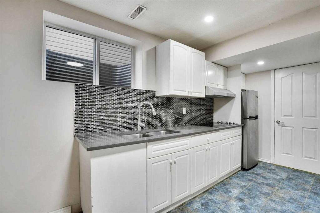 148 Martha'S Manor Ne, Calgary, AB - Indoor Photo Showing Kitchen With Double Sink