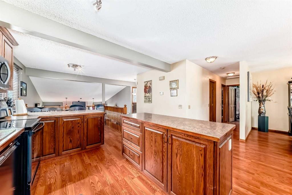 22 Glenhill Drive, Cochrane, AB - Indoor Photo Showing Kitchen With Double Sink