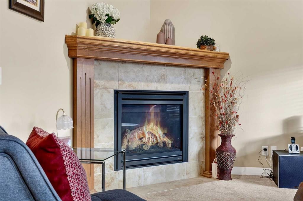 575 Everbrook Way Sw, Calgary, AB - Indoor Photo Showing Living Room With Fireplace