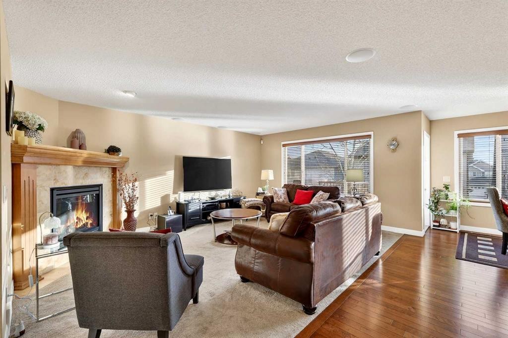 575 Everbrook Way Sw, Calgary, AB - Indoor Photo Showing Living Room With Fireplace