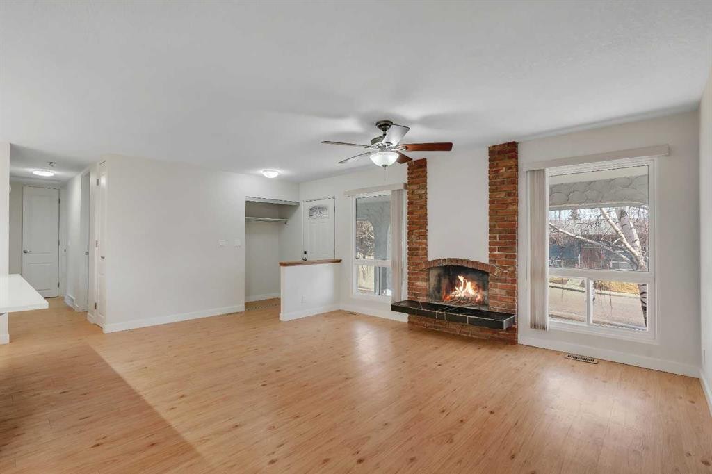 102 Huntham Place Ne, Calgary, AB - Indoor Photo Showing Living Room With Fireplace