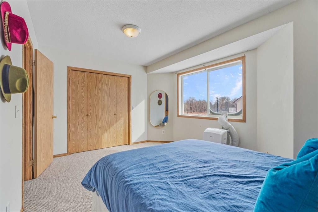 1301 Eagleview Place Nw, High River, AB - Indoor Photo Showing Bedroom