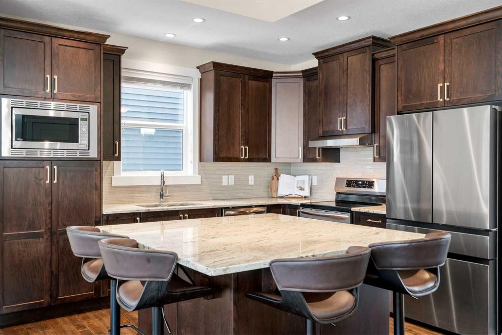 346 Cooperstown Common Sw, Airdrie, AB - Indoor Photo Showing Kitchen With Upgraded Kitchen