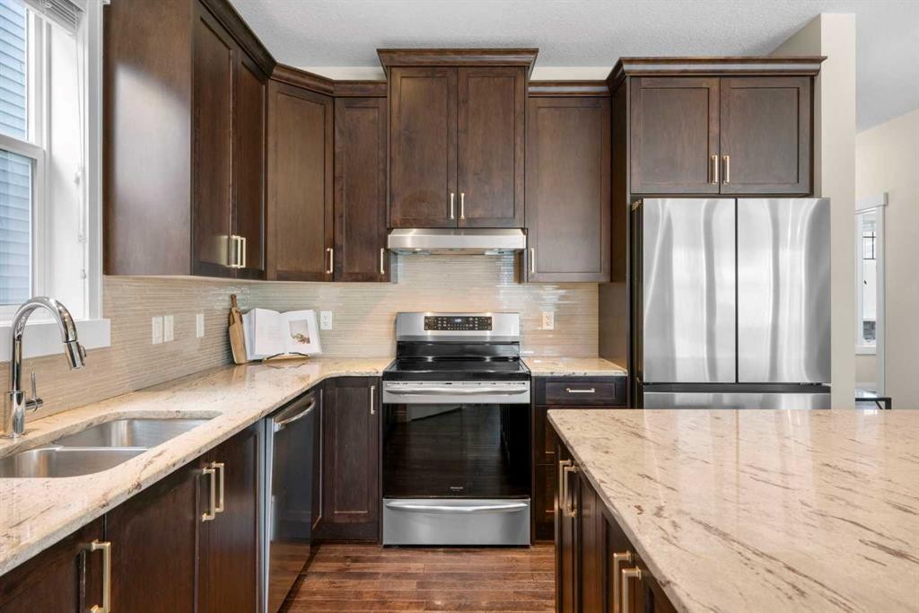 346 Cooperstown Common Sw, Airdrie, AB - Indoor Photo Showing Kitchen With Double Sink