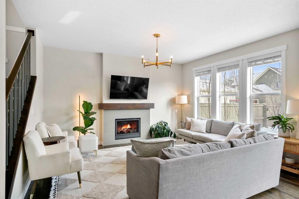346 Cooperstown Common Sw, Airdrie, AB - Indoor Photo Showing Living Room With Fireplace