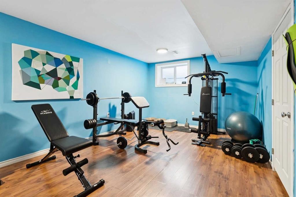 124 Cascades Pass, Chestermere, AB - Indoor Photo Showing Gym Room